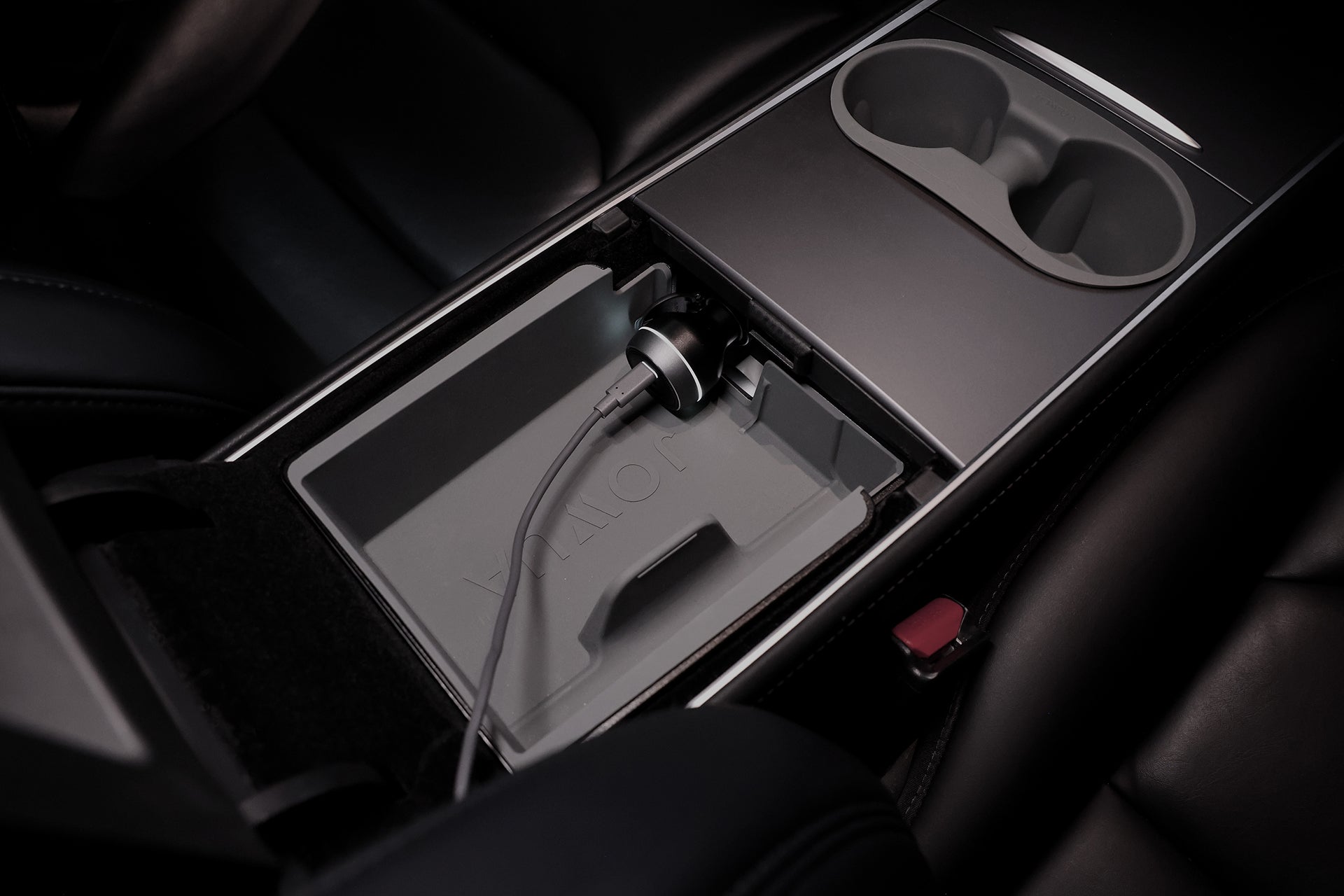 The JOWUA Car Refrigerator for Tesla Model 3 (2018-2024/Standard 2026+) is installed in the center console, with a Type-C power cable connected, cup holders above, and surrounded by dark leather seats.