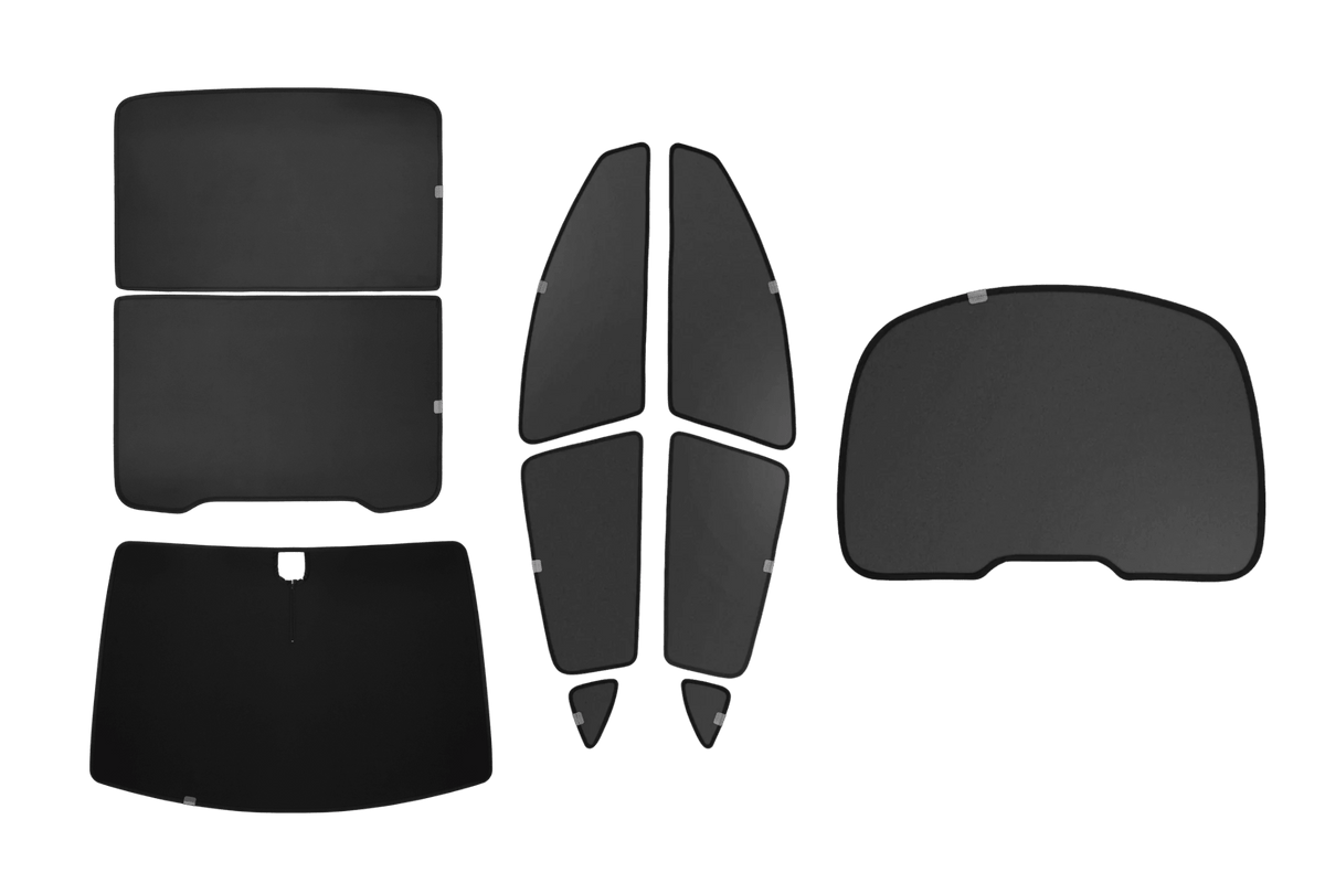 Six uniquely shaped, black JOWUA Ultimate Sunshade Bundle Model Y Juniper (2025+) sunshades are arranged on a white background. Each shade is tailored to fit specific Tesla Model Y window contours and delivers superior UV protection—making them an exceptional choice for Model Y owners.