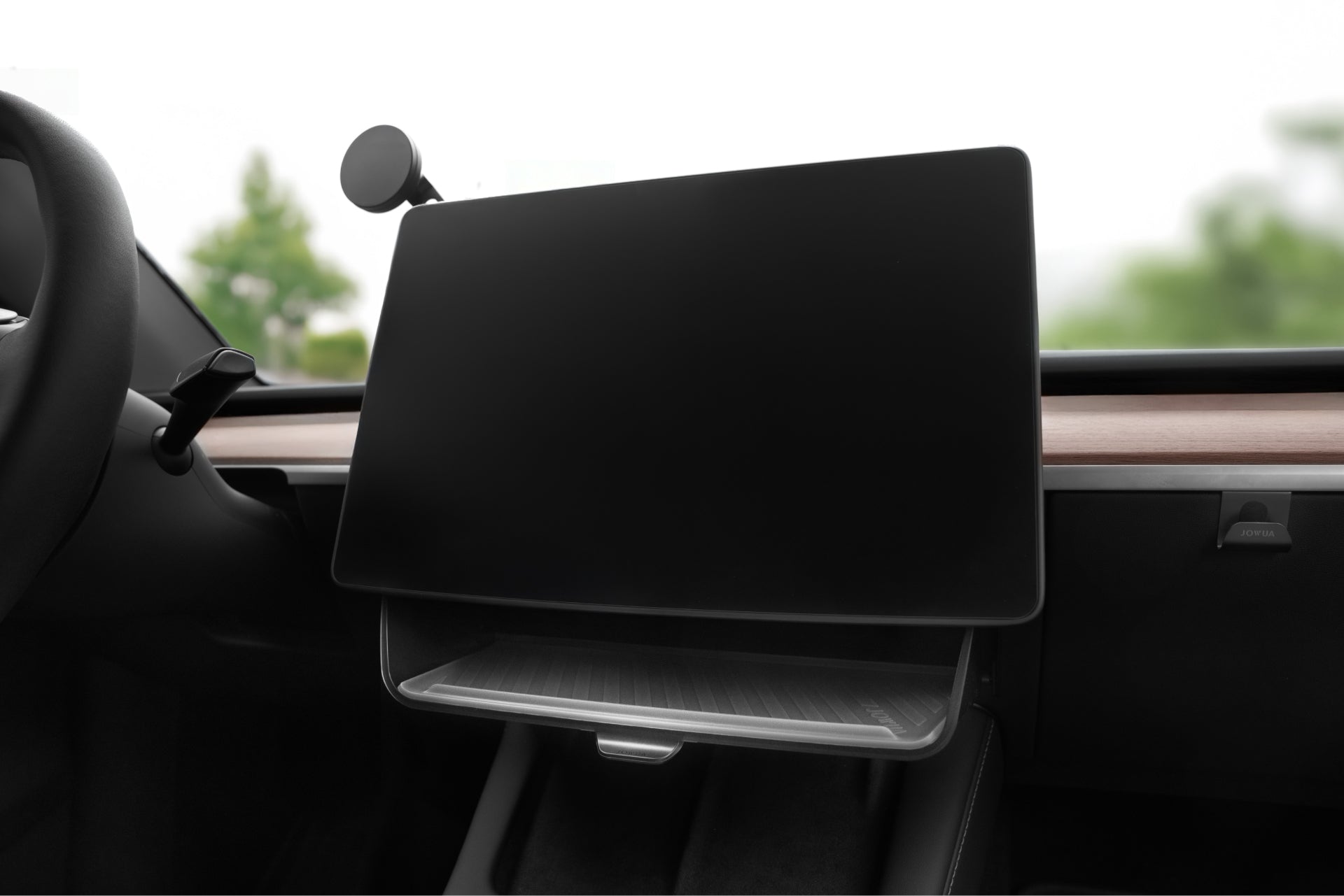 A modern car interior features JOWUA