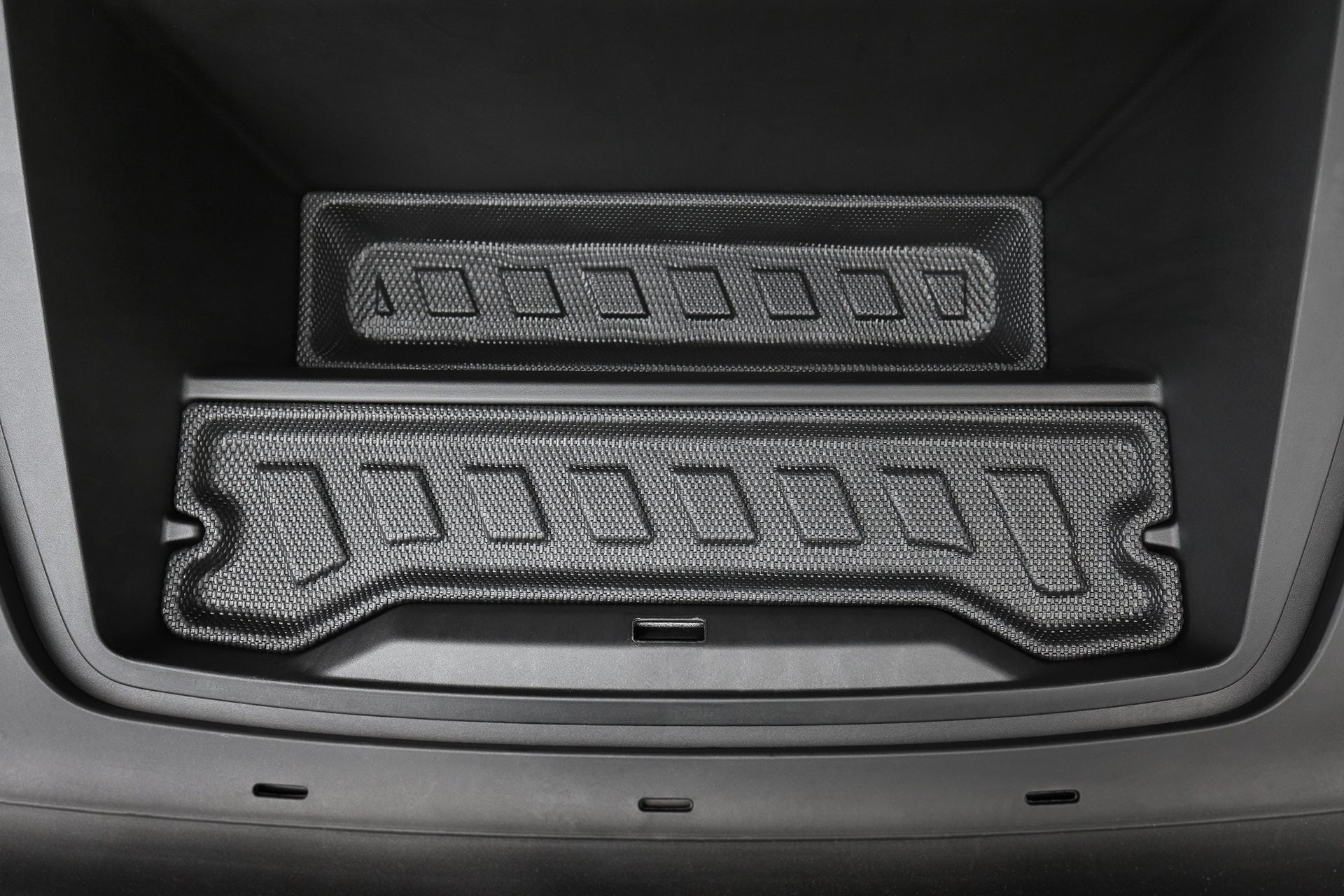Close-up of the Volvo EX30 front trunk (frunk) with JOWUA’s All Weather Trunk Liner + Rear Seat Cover—custom-fit, textured rubber mats provide lasting grip and protection as a durable all-weather cargo liner.