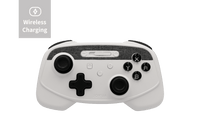 A JOWUA Tesla Gaming Controller (Wireless Charging) in white with black buttons, analog sticks, and accents is shown from above on a light background. The top left corner features a "Wireless Charging" label and icon.