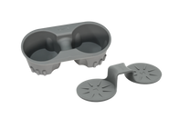 The JOWUA Cup Holder Set for Tesla Model 3 / Y is a gray plastic accessory designed to hold two cups securely. It features an easy-to-clean design with premium silicone elements, and includes a separate attachment that acts as a stabilizer for enhanced support.