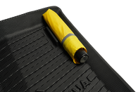 A rolled-up yellow umbrella lies on a textured black surface, similar to the sleek fit of JOWUA