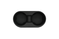 Introducing the JOWUA Center Console Cup Holder for Tesla Model 3 and Model Y: a black, oval-shaped double holder made from smooth silicone, equipped with a central divider. This cup holder is perfect for the center console and features rounded indentations with a subtle texture along its inner rims.