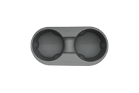 Here is an image of a gray silicone Center Console Cup Holder designed for the Tesla Model 3 and Model Y, featuring two circular compartments linked by a sturdy bridge. The brand name "JOWUA" is elegantly embossed on the upper side of the holder.