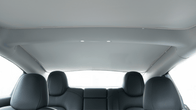 This image showcases the rear seat area of the JOWUA Model 3. It features gray upholstery and a sleek ceiling equipped with two small lights. The headrests are clearly visible, while the expansive rear window not only lets in abundant light but also offers UV protection for enhanced comfort.