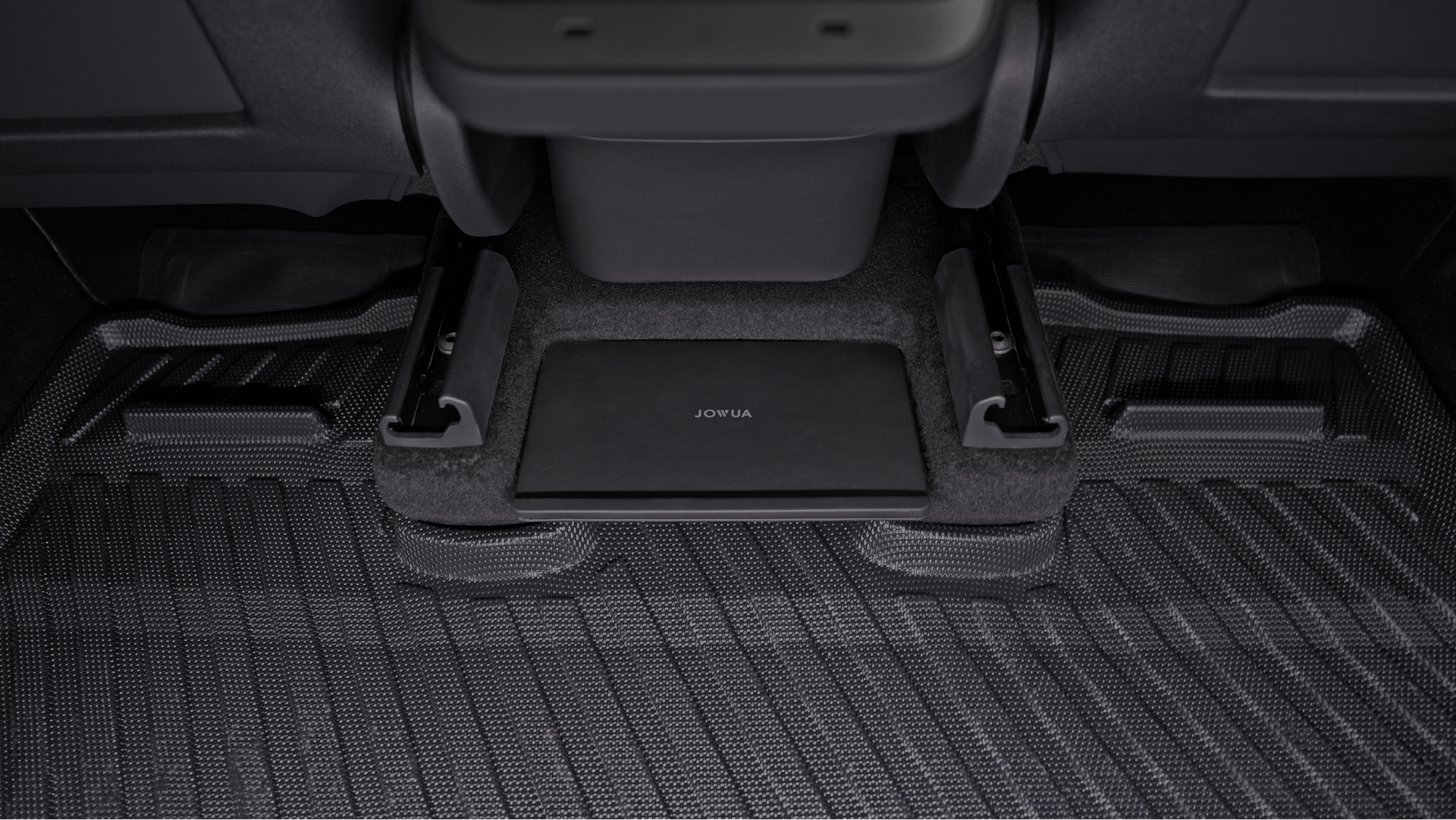 A black Model Y Tissue Box Holder Set by JOWUA, designed specifically for a Tesla Model Y, fits snugly under the vehicle
