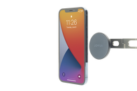 A smartphone with a vibrant lock screen floats beside the JOWUA 6D Tesla Compatible Invisible Foldaway Car Mount Qi2 Wireless Charger (MagSafe), showcased on a white background.